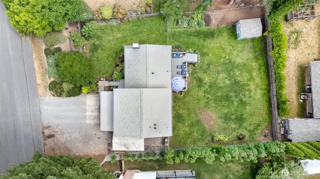 Great aerial view highlighting the home and its surrounding landscape.