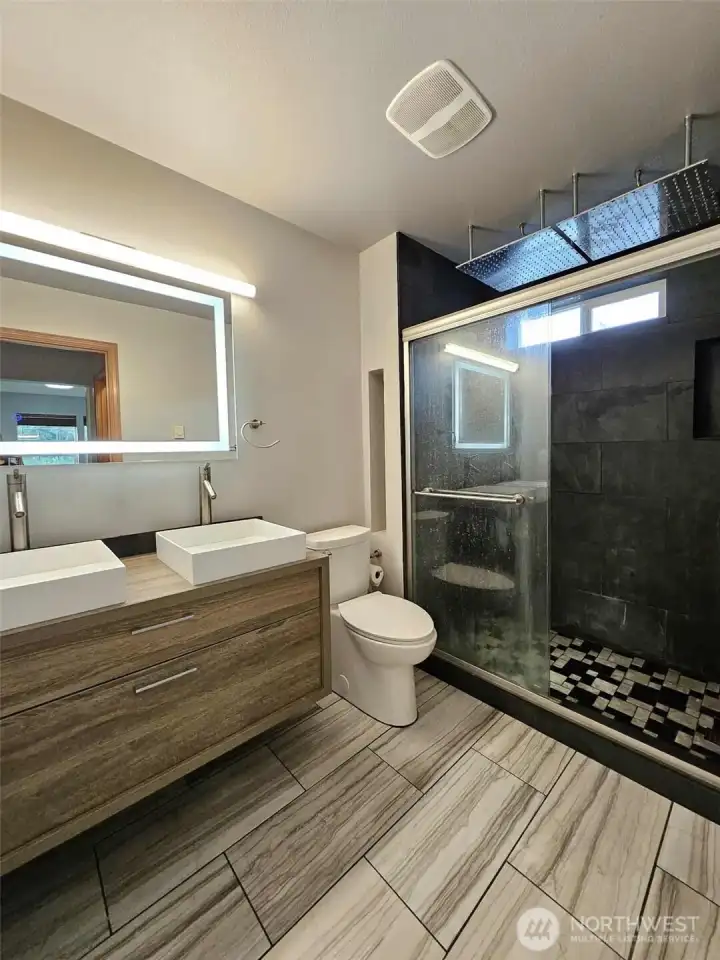 En-suit bathroom with dual rain shower heads and back jets!