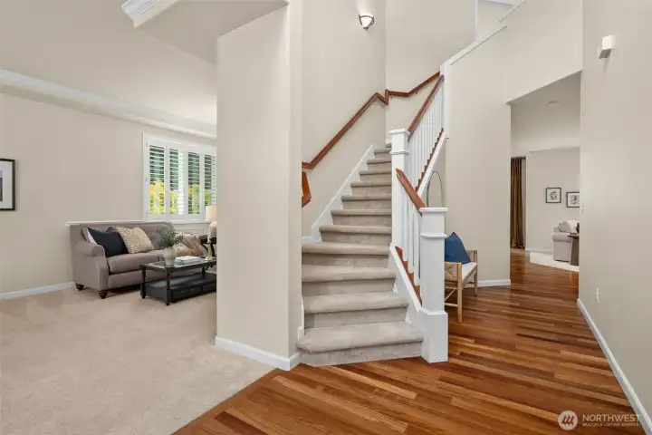 A grand, vaulted entry way sets the tone as you walk into the front door. To the left, a formal living/dining area with room to entertain - or even the perfect home for a piano!
