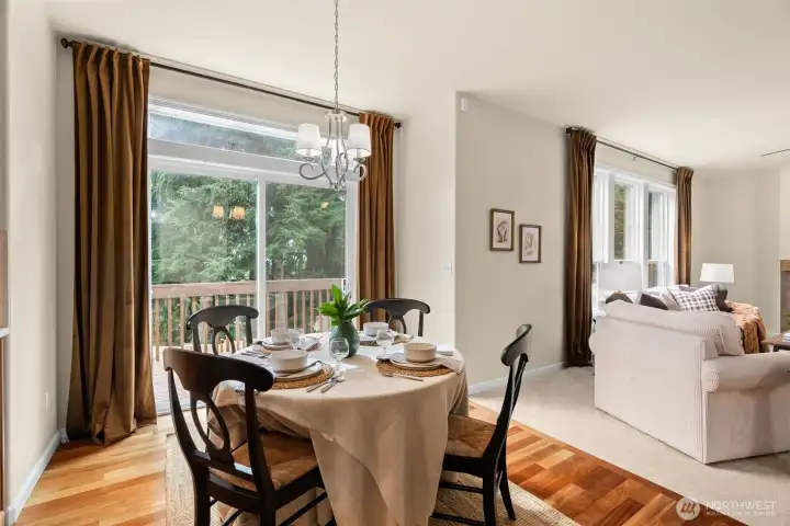 Right off the dining area, the entrance to the generous sized deck overlooking the expansive back yard.