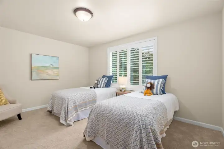And finally, the 4th bedroom upstairs is also large and features two generous windows and a large closet.