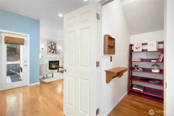 Under-stair storage/ walk-in pantry keeps your home organized.