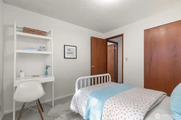 All bedrooms are carpeted and have closets.
