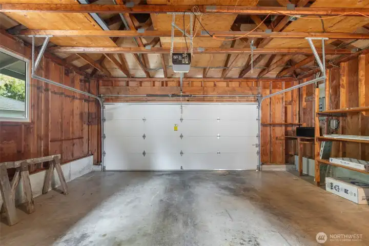 Two car garage with extra space for storage. The utility room is also here.