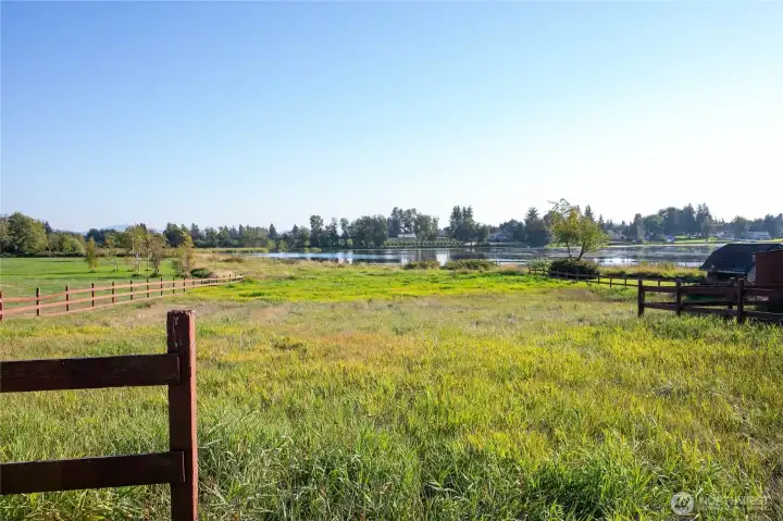 The fenced land has enough room for livestock. The lot extends to the middle of the lake