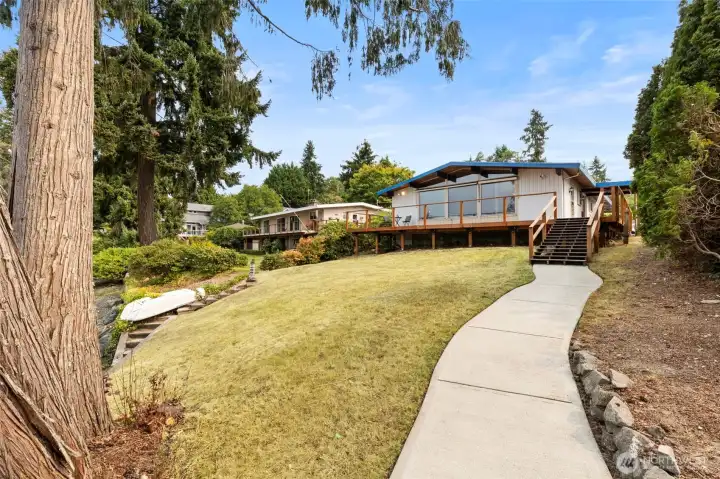 Paved walkway to dock from the house.
