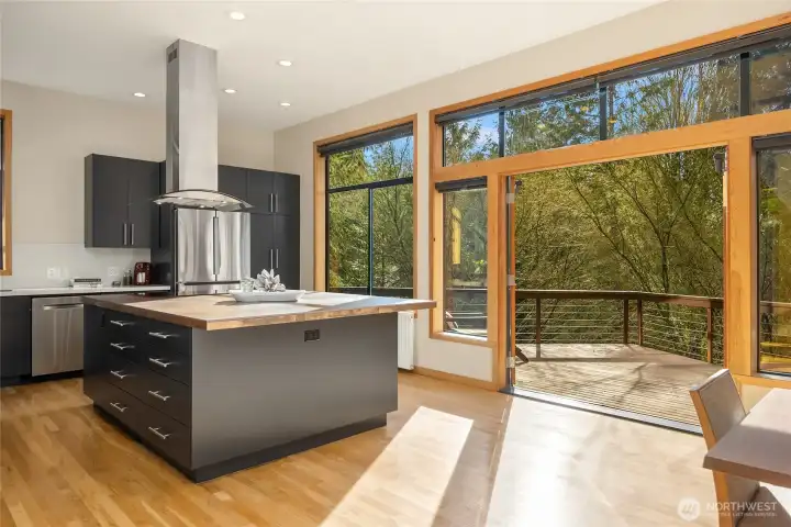 An impressive room with a true wall of windows facing west. Throw open the doors and enjoy dinner outside in the sunshine.