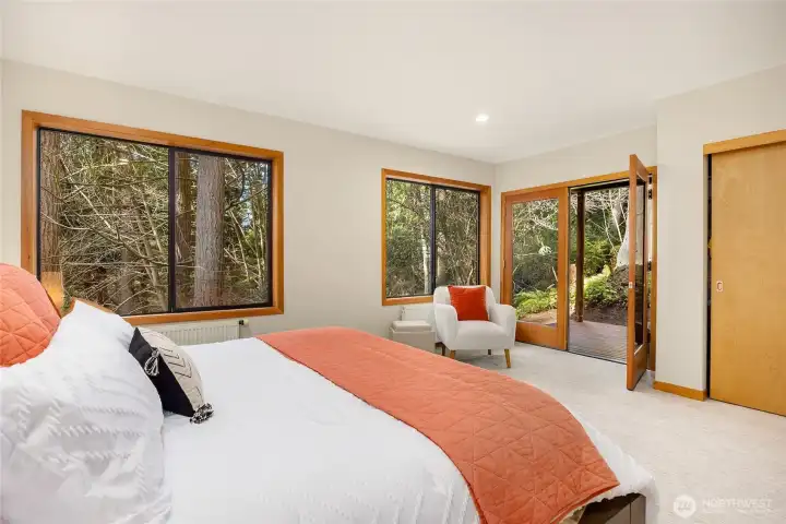 Over-sized windows are in this room too plus another French door leading out to a cozy private deck.