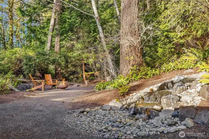 There are two fountains on the property and a fire pit area off of the primary bedroom.