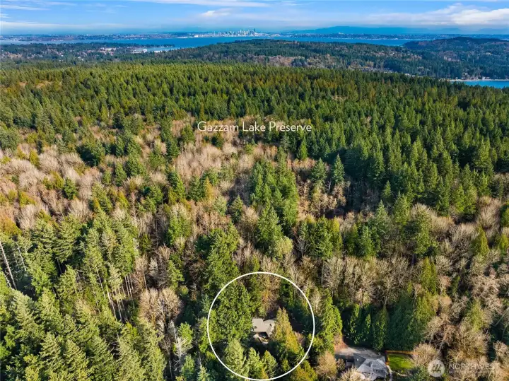 The property backs to the popular Gazzam Lake Nature Preserve to the east and borders a 6-acre Land Trust protected property to the north.