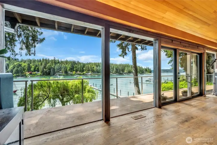 Walk out to the deck with custom manufactured S/S railings leading you to the exquisite patio, hot tub, built-in stereo system, exterior lighting and BBQ which all take in the water views.