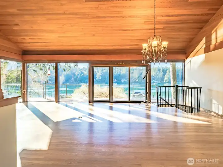 Living Room/Great Room  Spectacular floor to ceiling wood wrapped windows with argon gas, exterior sun shades. Custom corner window adds to the 180 degree serene water & sunset views.