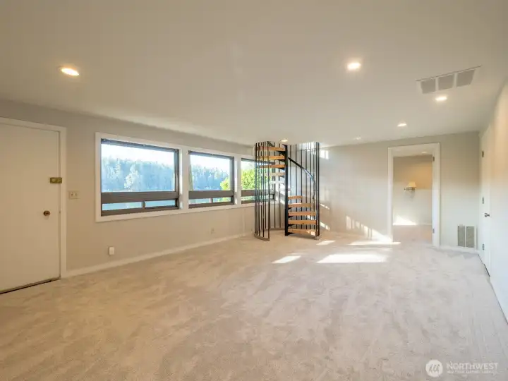 To The Beach/Dock is easy access from the recreational room downstairs, access to 2nd primary bedroom with ensuite in background