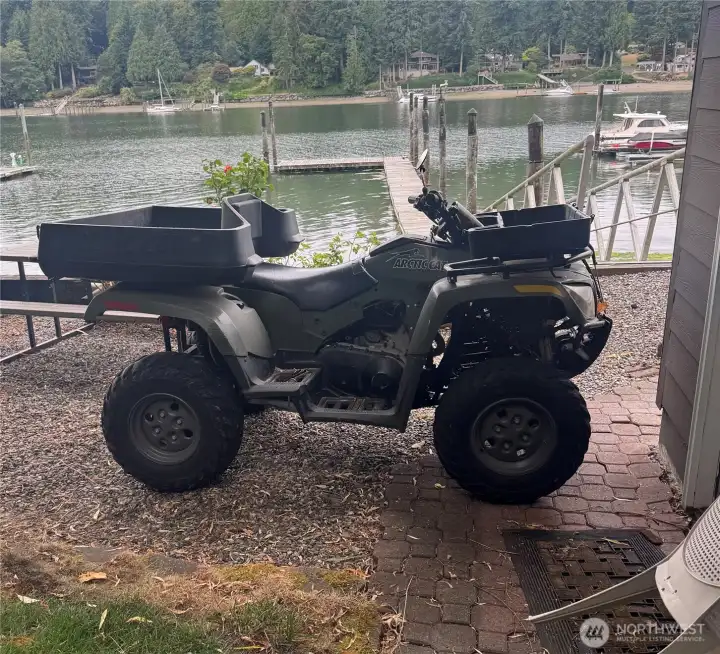 Artic cat 4x4 500 cc 2 person included in the sale. It's great to load up supplies to take to your boat on a dedicated ATV trail from the home down the switchback trail to the beach.