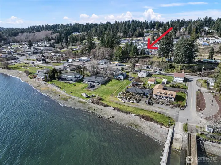 The home has a front-row view to the historic Allyn waterfront and town.