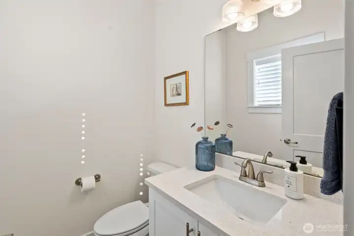 The 1/2 bath on the main floor is down a short hall, perfect for guests.