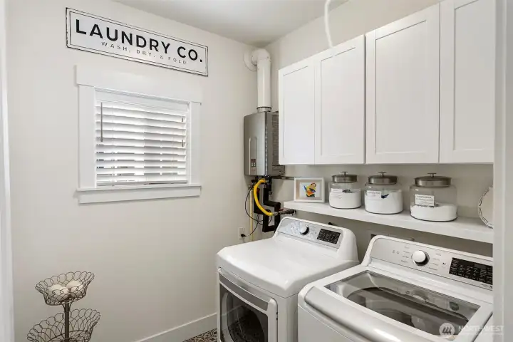 The laundry room is convenient to the kitchen, and hosts the tankless water heater.  A new heat pump with A/C was installed in 2024.