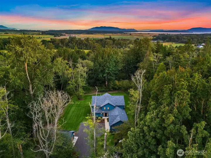 Set on 5.33 private acres, this artisan-crafted estate delivers a refined blend of luxury, privacy, and Northwest elegance.