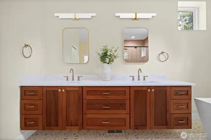 Spa dual vanity, solid wood cabinetry and soaking tub round out the perfect primary bathroom.