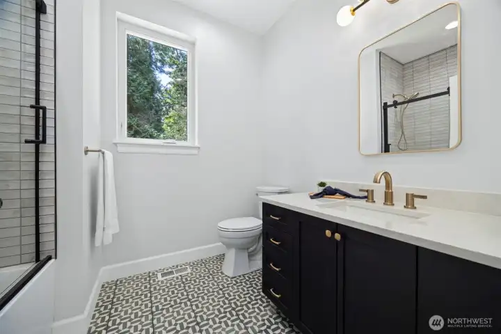 Full bath on the main just outside the home office.