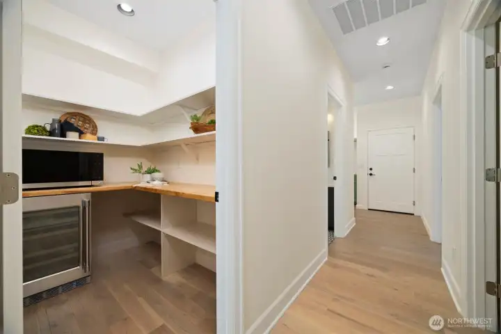 Convenient and spacious walk-in pantry with wine fridge.