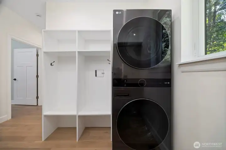 Come in from the garage to a nook to remove coats and shoes. Pop dirty items in the laundry.