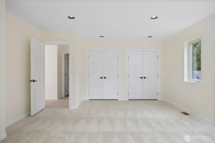 Magnificent guest room with dual closets.