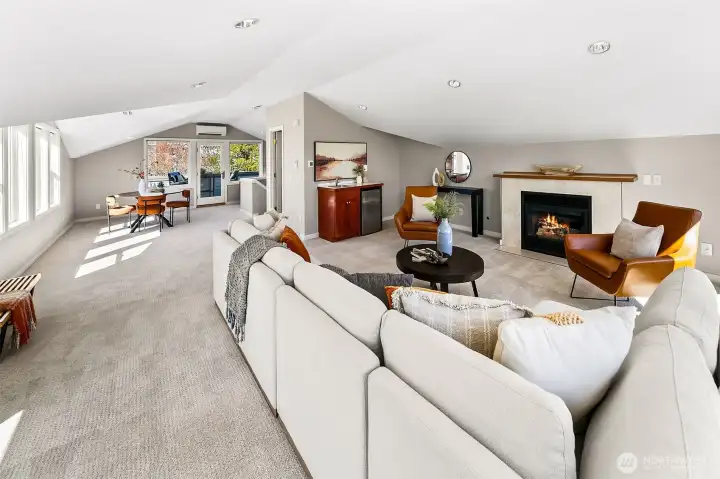 Easily create a 2nd primary suite up here or just enjoy as the fabulous view rec room it is. Gas fireplace, wet bar, half bathroom (can add a shower or a tub) & big view deck too.