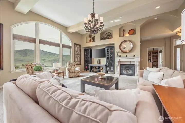 Stunning wall of windows, Vaulted ceilings and gas fireplace.