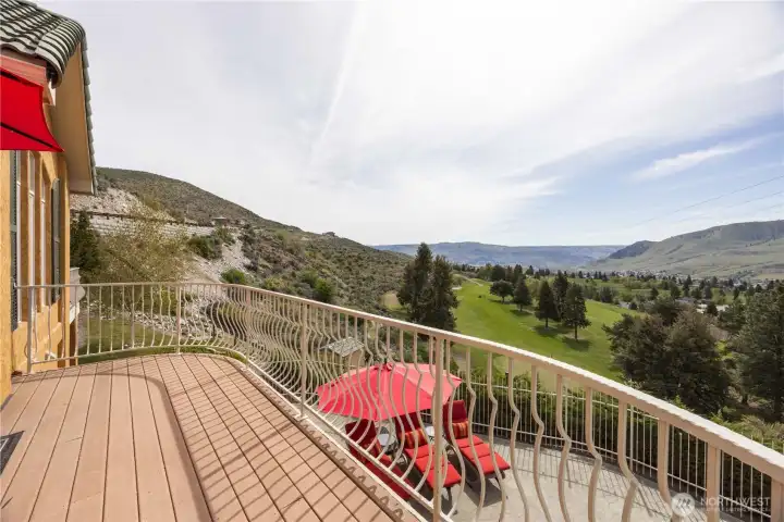 Expansive view deck perfectly positioned to capture breathtaking panoramic vistas of Lake Chelan, the surrounding mountains, and the lush golf course below. This inviting outdoor space offers the ideal setting for morning coffee or evening relaxation, where you can take in sweeping scenery and unforgettable sunsets. With ample room for seating and entertaining, the deck seamlessly extends the living space into the beauty of the outdoors.