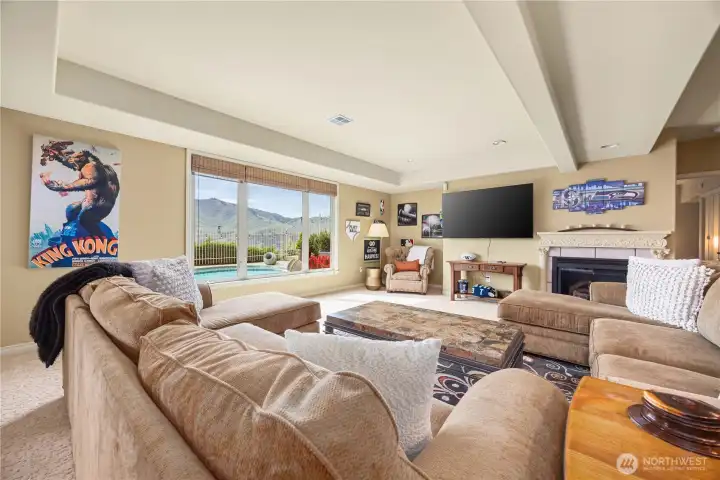 Lower living with propane fireplace overlooking the pool and stunning view of Chelan Butte
