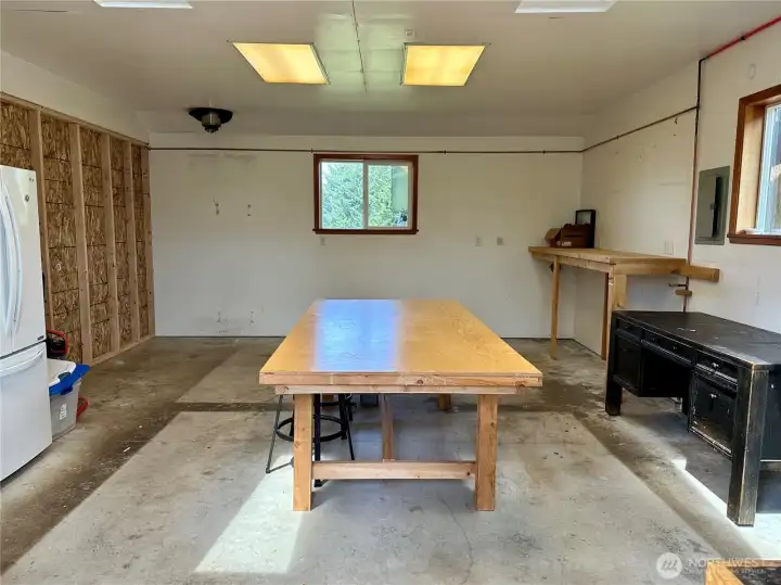 Shop attached to garage. Temporary wall on the left can be removed to expand shop size Shop attached to garage. Temporary wall on the left can be removed to expand shop size