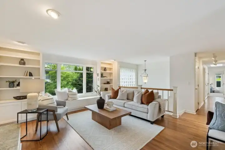 Inviting light and bright living area with hardwood floors, and tons of built-in smart storage solutions throughout the home. Inviting light and bright living area with hardwood floors, and tons of built-in smart storage solutions throughout the home.