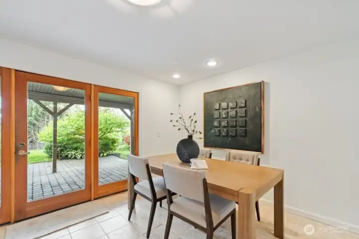 Informal eating area on lower level with outdoor backyard access Informal eating area on lower level with outdoor backyard access