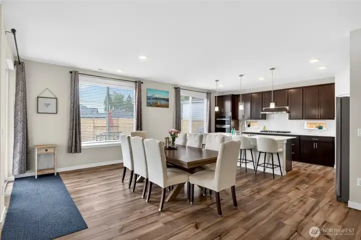 Open concept layout seamlessly connects the dining area, kitchen and great room