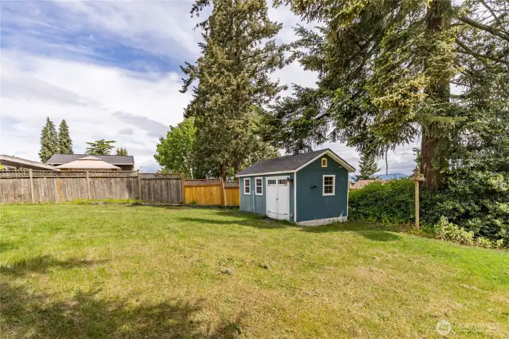 Your own private oasis - the expansive, fully-fenced yard offers mature trees and excellent privacy