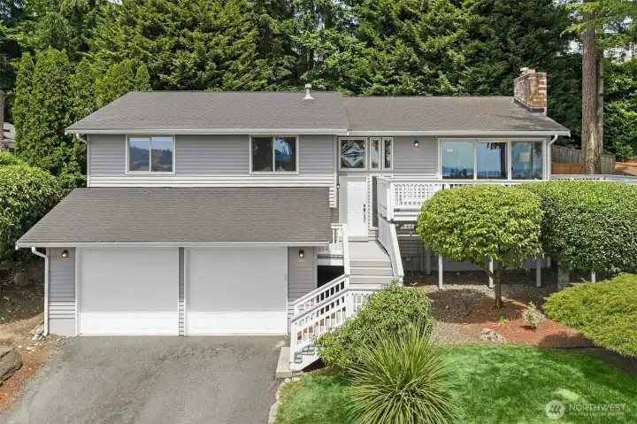 Breathtaking views of Lake Washington, Mt. Rainier, and the Seattle & Bellevue skylines take center stage in this beautifully updated home, on a quiet, friendly street