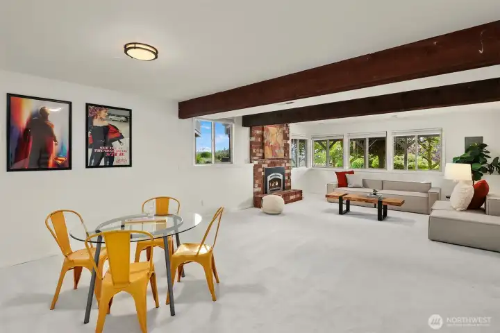 Spacious family room with gas fireplace on the lower level offers a second gathering place for fun and entertainment