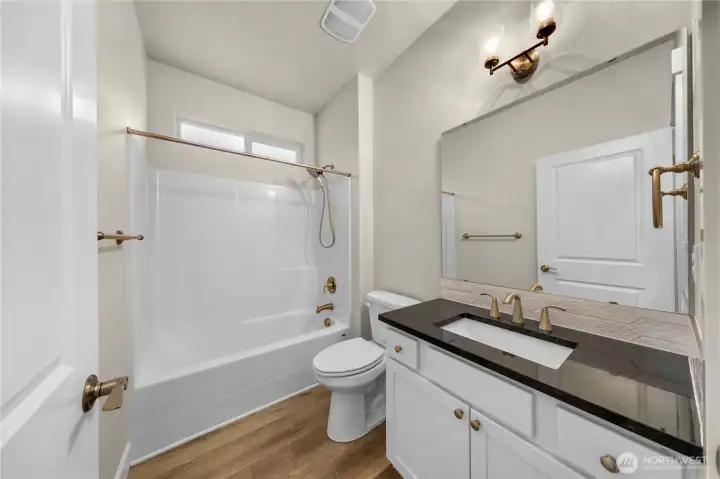 Full guest bath conveniently placed next to first bedroom for easy access family and guests