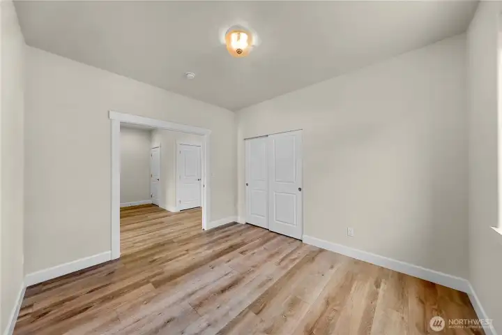 Second bedroom or office space - this bedroom has solid sliding pocket doors adding versatility to fit your needs
