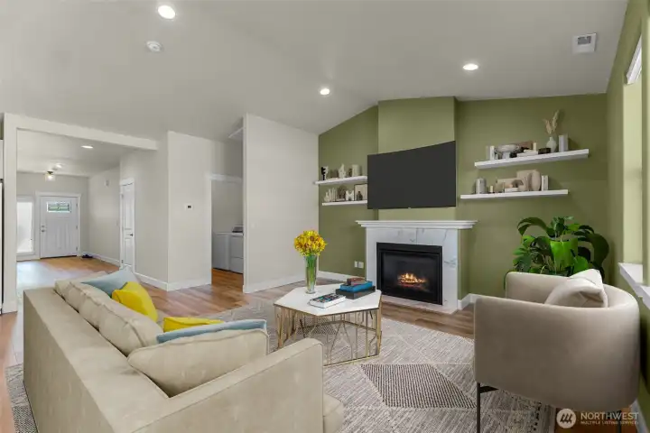 Vaulted ceilings and natural light make this space bright, add in the gas fireplace and you get cozy too! *virtually staged*