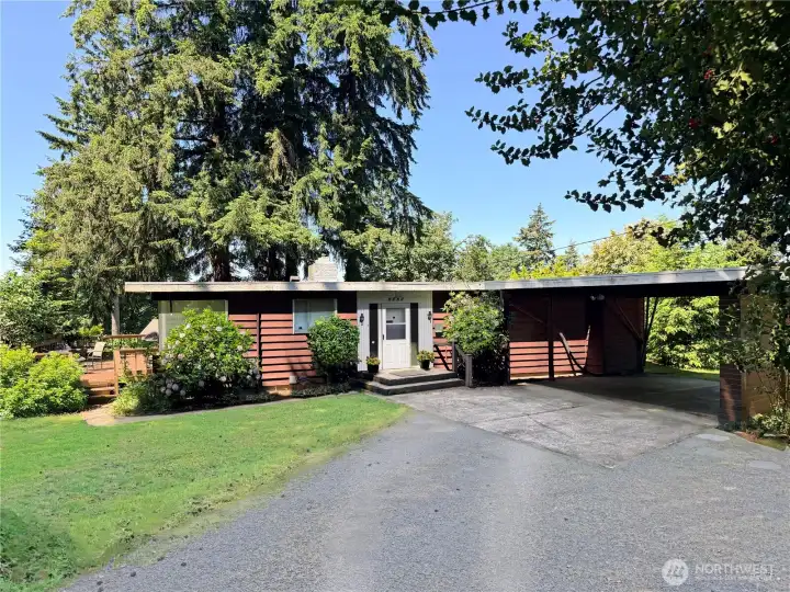 Here you can see part of the circular driveway and 2 car carport. Lots of extra parking too off to the right of the carport. (See next photo)