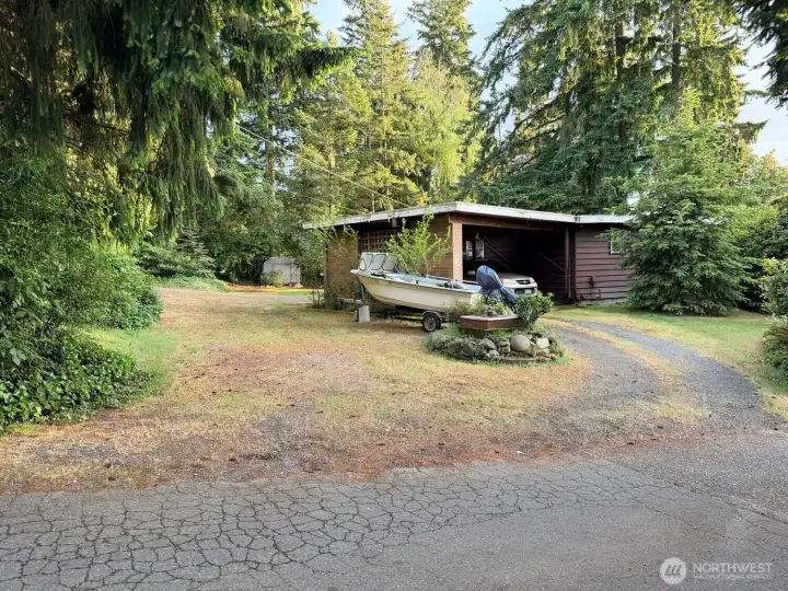 The other side of the circular driveway and RV parking. Plenty of parking for guests, your car collection or other vehicles. If you don't care for extra parking, turn part of the space into a garden or patio.