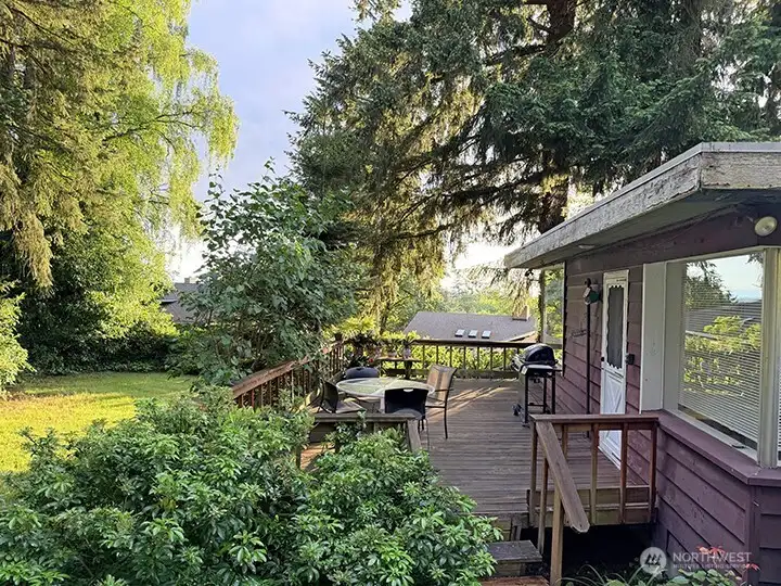 Enjoy sunsets from the deck with peek Olympic Mtn views