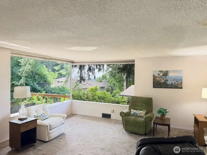 The living room has large south and west facing giving you that light and airy feeling. There is a peek view of the Olympic mts and you can enjoy the colorful sunsets.