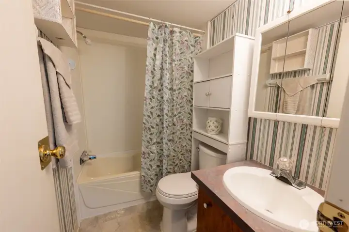 Second bathroom with tub and shower