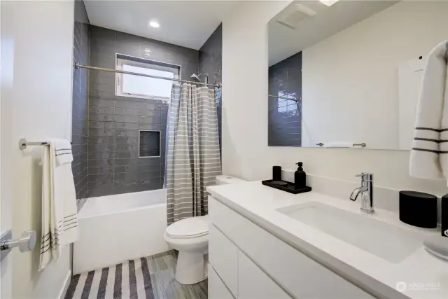 Second full bathroom on second level. Radiant heated floor.
