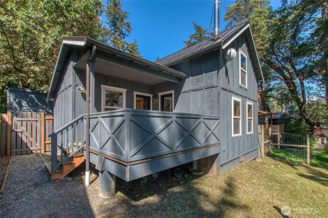 A sweet deck overlooks the large yard and the waterview.