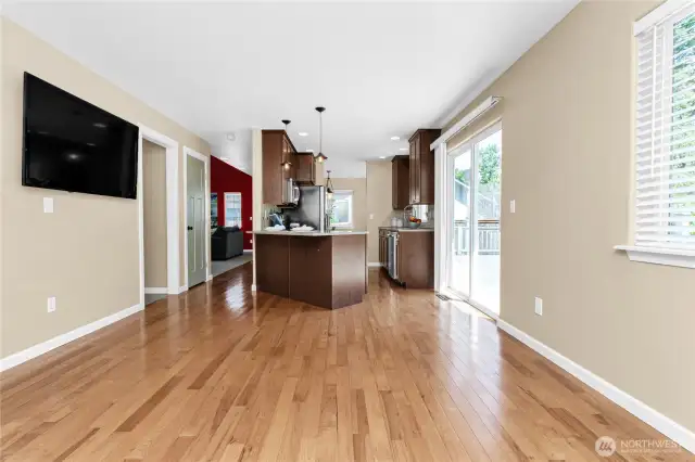 Family room is adjacent to kitchen; TV will convey with home.