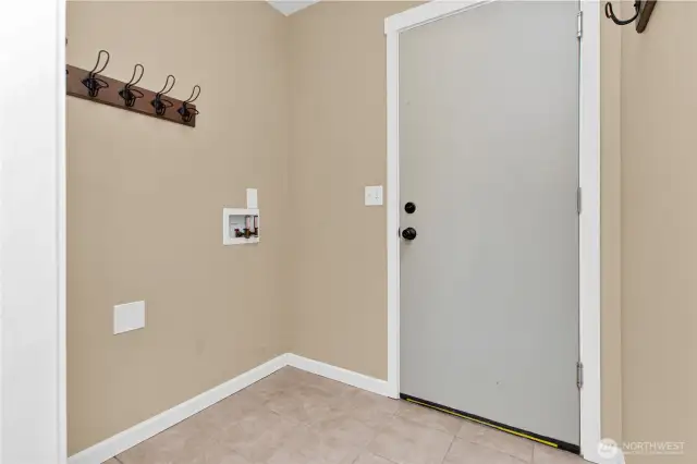 This laundry area has been relocated to 2nd floor with updated plumbing. This space is used as mud room now. The door is access to garage.
